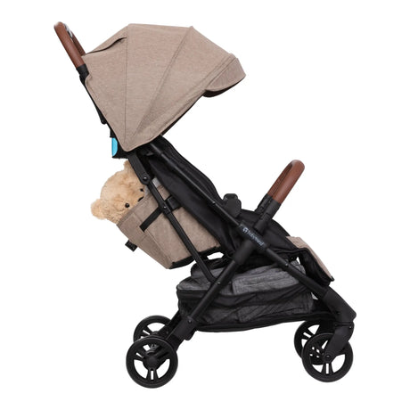 Side view of the Baby Trend York Compact Stroller with the cargo basket in used