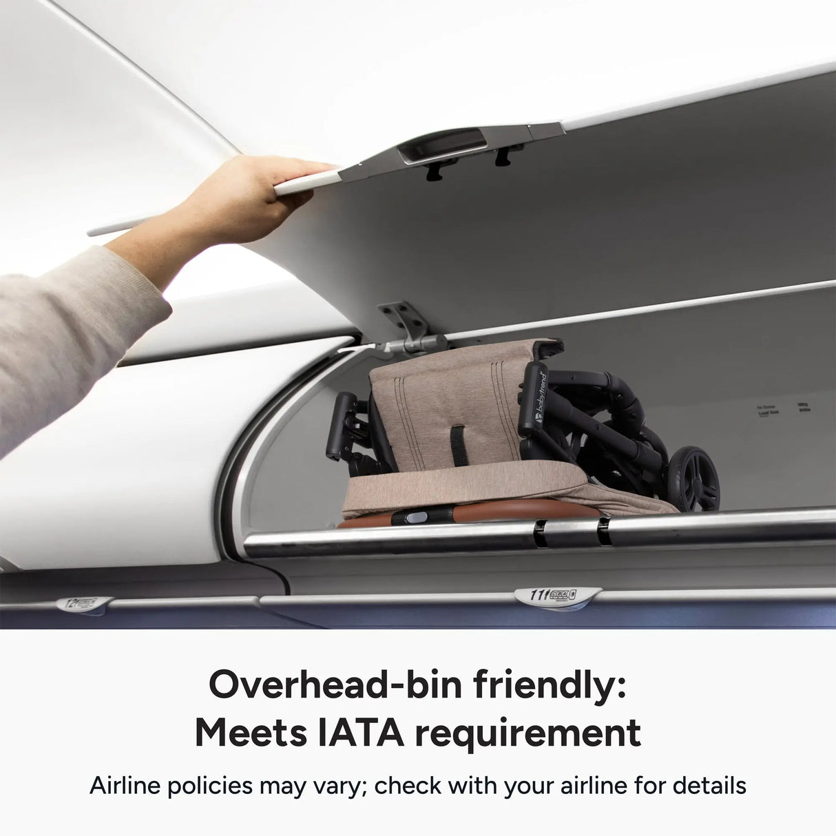 A person placing the Baby Trend York Compact Stroller in the overhead bin of an airplane