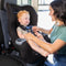 Mom is looking after her child sitting in the Baby Trend Trooper Convertible Car Seat