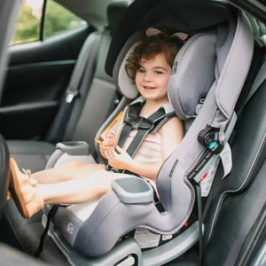 A toddler is sitting in the front facing position with the Baby Trend Cover Me Convertible Car Seat