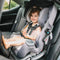 A toddler is sitting in the front facing position with the Baby Trend Cover Me Convertible Car Seat