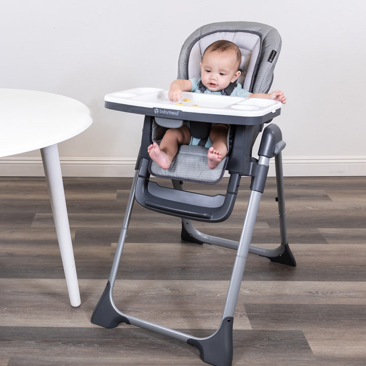 A child sitting on the Baby Trend Sit Right 2.0 3-in-1 High Chair for feeding time