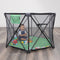 A child is playing and sitting in the Baby Trend Play Zone Pop-up Play Pen