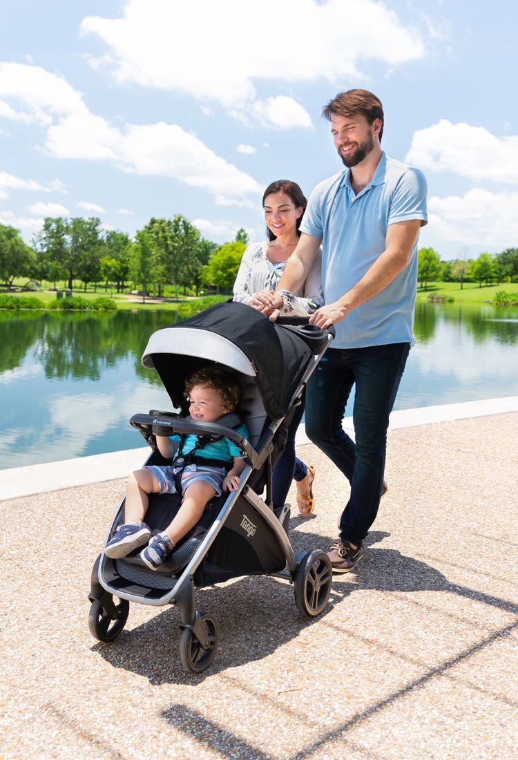 Young couple with baby in stroller