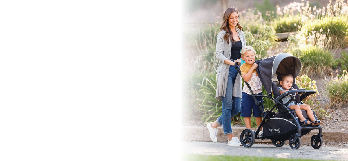 Woman pushing children in stroller