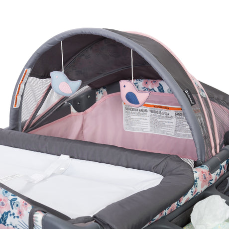 Baby Trend Deluxe II Nursery Center Playard canopy with two hanging toys