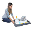 Load image into gallery viewer, Trend Walker by Baby Trend mother folding the walker compact