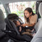 Baby Trend EZ-Lift PLUS Infant Car Seat mom place her child in the car seat