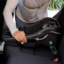 Load image into gallery viewer, Mom is installing the Baby Trend EZ-Lift PLUS Infant Car Seat base using the flip foot