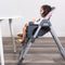 Toddler girl sitting at the dining table on the Baby Trend Sit Right 2.0 3-in-1 High Chair