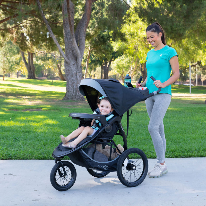 Mom and child enjoying their day outdoor with the Baby Trend Expedition Race Tec Plus Jogger Stroller