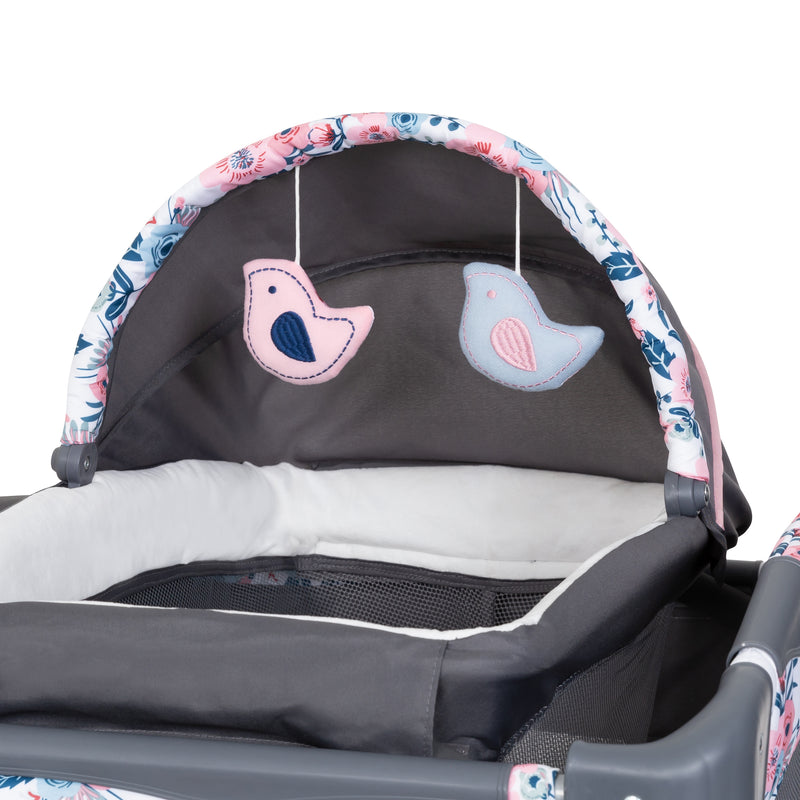 Two hanging toys included on the napper from the Baby Trend Lil' Snooze Deluxe II Nursery Center Playard