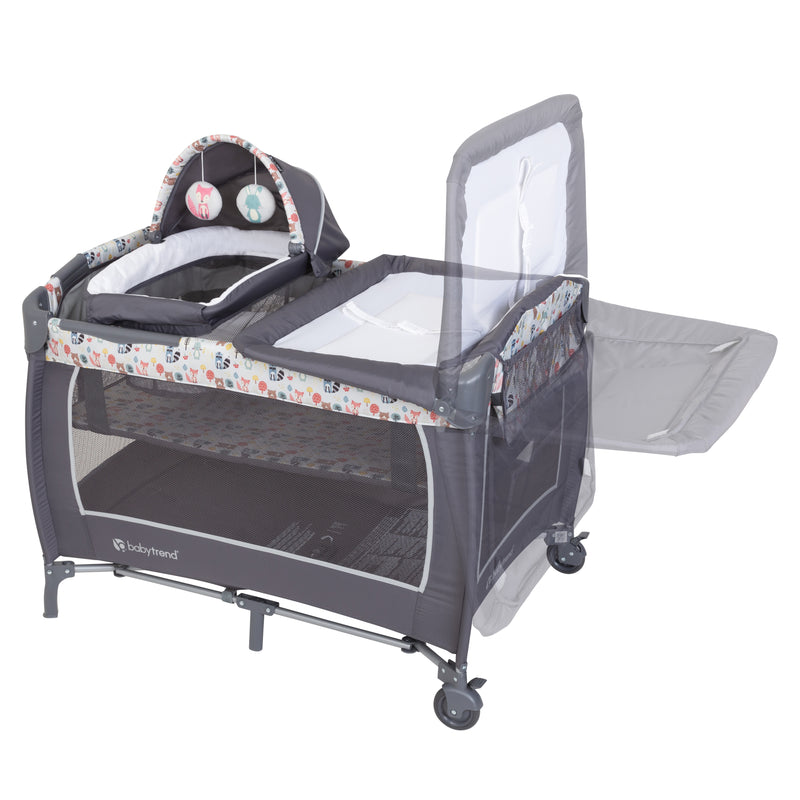 The changing table can flip away on the Baby Trend Lil’ Snooze Deluxe II Nursery Center Playard