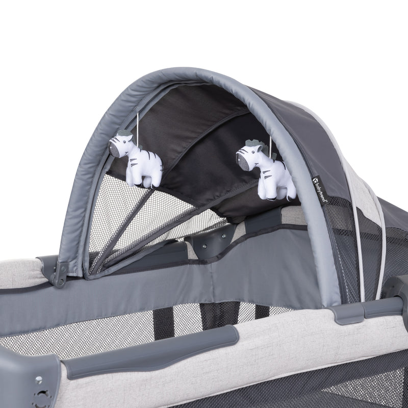 Canopy has two hanging toys on the Baby Trend Deluxe II Nursery Center Playard