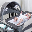 Load image into gallery viewer, Baby waiting to be change on the Baby Trend Deluxe II Nursery Center Playard