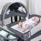 Baby waiting to be change on the Baby Trend Deluxe II Nursery Center Playard
