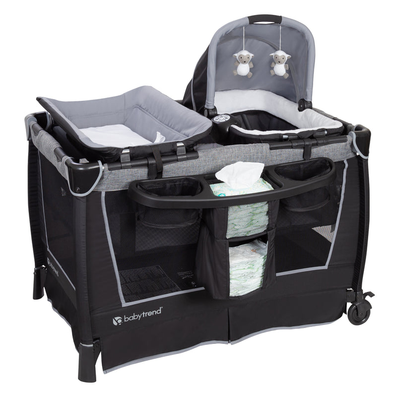 Changing table and diaper organizer is included with the Baby Trend Retreat Twins Nursery Center Playard
