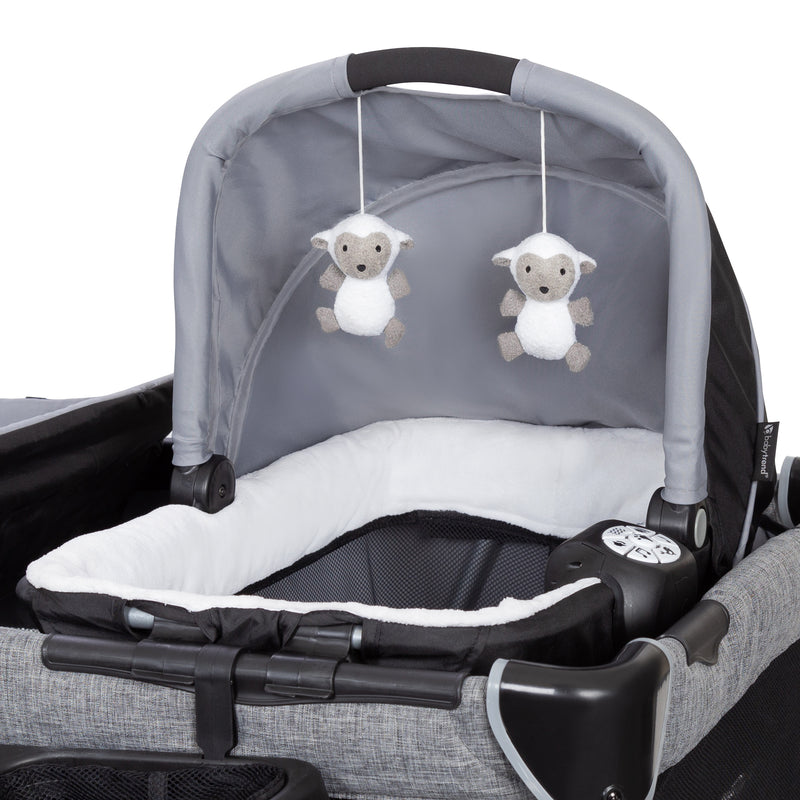 Two hanging toys included on the Removable Rock-A-Bye Bassinet of the Baby Trend Retreat Twins Nursery Center Playard