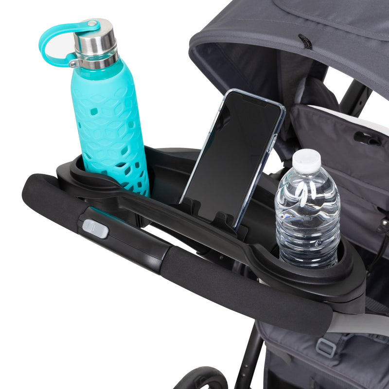 Parent console with cell phone holder and two cup holders on the Baby Trend Sit N Stand 5-in-1 Shopper Stroller
