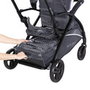 Load image into gallery viewer, Extra large storage basket with rear access on the Baby Trend Sit N Stand 5-in-1 Shopper Stroller