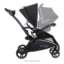 Load image into gallery viewer, Side view of the Baby Trend Sit N Stand 5-in-1 Shopper Stroller with infant car seat on the child's seat, sold separately