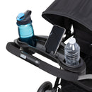Load image into gallery viewer, Baby Trend Sit N' Stand 2.0 stroller with parent tray, two cup holders, and cell phone holder