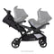 Side view of the Baby Trend Sit N' Stand Double 2.0 Stroller with car seat in the front and one in the back seat