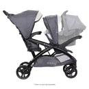 Load image into gallery viewer, Side view of the Baby Trend Sit N' Stand Double 2.0 Stroller with an infant car seat in the front seat for a travel system