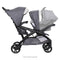 Side view of the Baby Trend Sit N' Stand Double 2.0 Stroller with an infant car seat in the front seat for a travel system