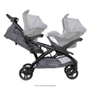 Load image into gallery viewer, Side view of the Baby Trend Sit N' Stand Double 2.0 Stroller with an infant car seat in the front and rear seat for a travel system