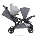 Load image into gallery viewer, Side view of the Baby Trend Sit N' Stand Double 2.0 Stroller with an infant car seat in the rear seat for a travel system