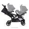 Side view with two car seats of the Baby Trend Sit N' Stand Double 2.0 Stroller, infant car seat sold separately