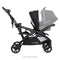 Side view of the Baby Trend Sit N' Stand Double 2.0 Stroller with car seat in front seat and rear seat as jump seat or stand on platform, infant car seat sold separately