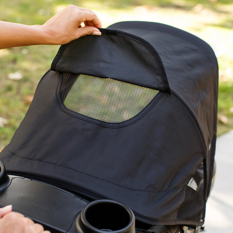 The canopy has a peek-a-boo window on the Baby Trend Pro Steer Jogger Stroller Travel System 