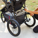 Load image into gallery viewer, Extra large storage basket on the Baby Trend Pro Steer Jogger Stroller Travel System 