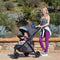 Mom is strolling with her child outdoor in the Baby Trend Tango 3 All-Terrain Stroller Travel System