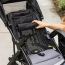 Load image into gallery viewer, The seat back roll up for mesh air flow onto the child of the Baby Trend Sonar Seasons Stroller Travel System with EZ-Lift 35 Infant Car Seat