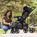 Load image into gallery viewer, Include large storage basket with front access of the Baby Trend Sonar Seasons Stroller Travel System with EZ-Lift 35 Infant Car Seat