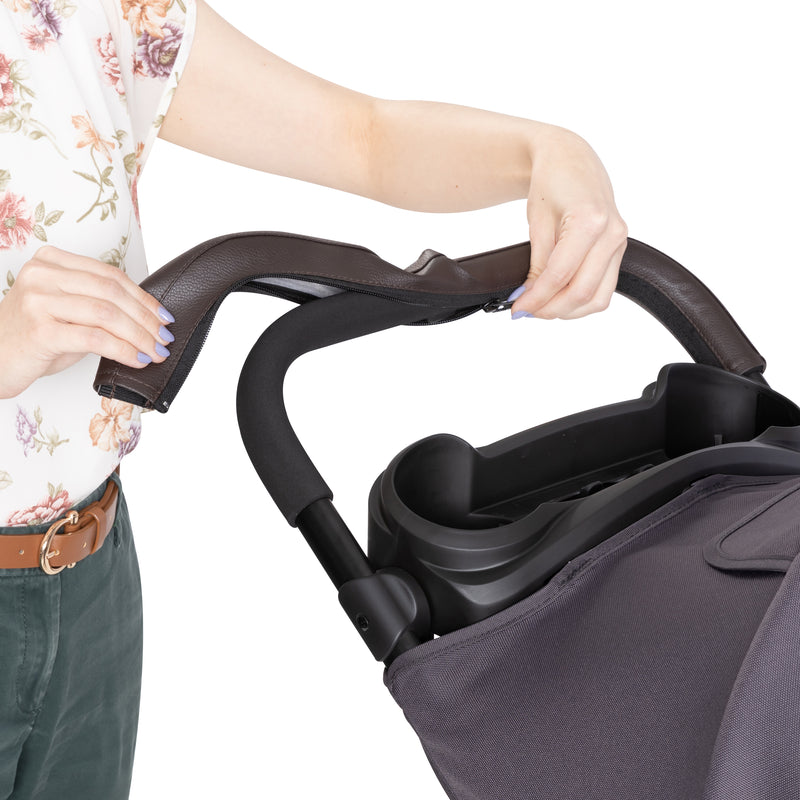 The leather handle can be taken off with the zipper for a foam handle on the Baby Trend Sonar Cargo 3-Wheel Stroller Travel System with EZ-Lift 35 PLUS Infant Car Seat