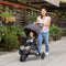 Mom is pushing her child in the Baby Trend Sonar Cargo 3-Wheel Stroller Travel System