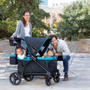 Load image into gallery viewer, Mom and dad taking their two children out door strolling with the Baby Trend Expedition 2-in-1 Stroller Wagon PLUS