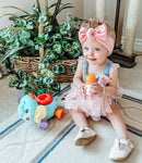 Load image into gallery viewer, Baby girl is playing with the Smart Steps by Baby Trend Ele-fun Talk and Play STEM toy