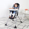 Child girl sitting in the Baby Trend Fast Fold High Chair