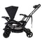 Baby Trend Sit N' Stand Double Stroller can transform with a child sitting in front and another child using the rear stand on platform or to sit