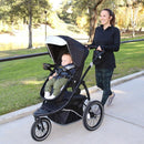Load image into gallery viewer, MUV by Baby Trend 180° 6-in-1 Jogger Stroller Travel System with Kussen Infant Car Seat