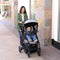 Baby Trend City Clicker Pro Snap Gear Stroller Travel System of mother strolling her child sitting in the forward position